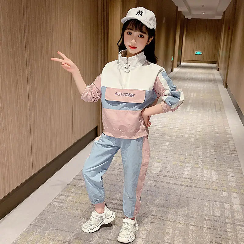 Person wearing a colorful outfit with a cap in an indoor setting