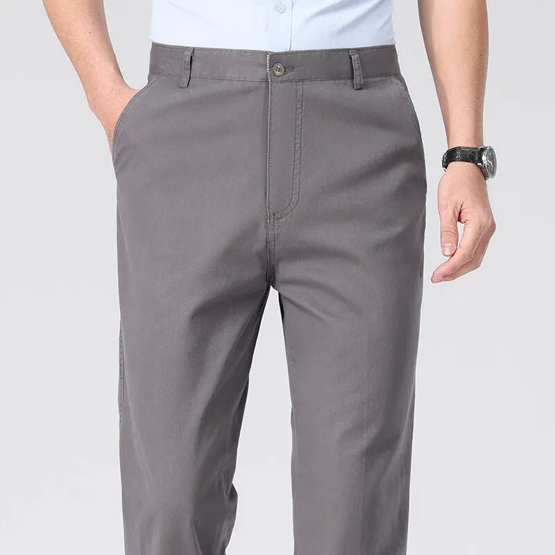 Gray pants worn by a person on a plain background