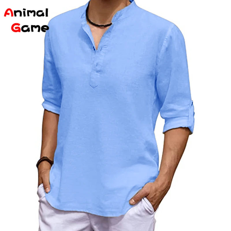 Man wearing a light blue shirt with rolled-up sleeves on a white background, with 'Animal Game' branding.