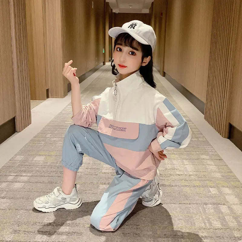 Child in a colorful outfit posing in a hallway