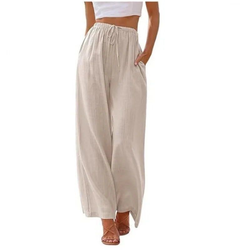 Beige wide-leg pants worn by a person on a white background