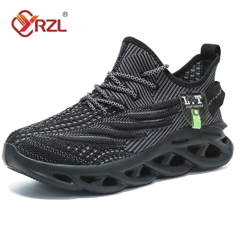 A pair of YRZL branded black sports running shoes with mesh upper material and a rubber outsole, displayed against a cardboard background.
