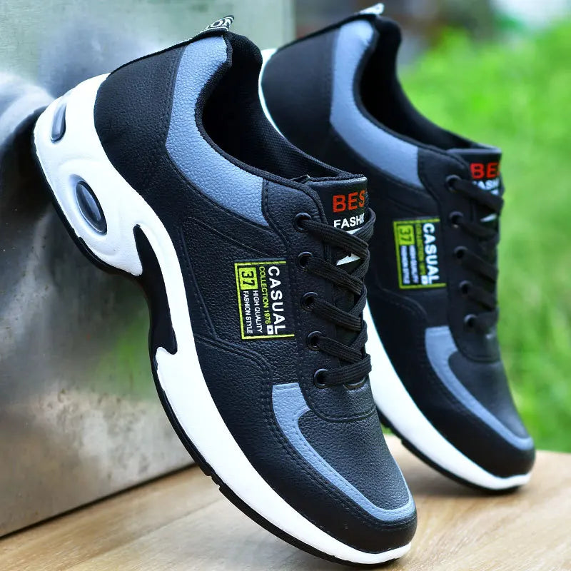 Black and blue casual sneakers with visible branding on a wooden surface.