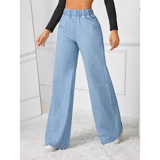Light blue wide-leg jeans worn by a person on a white background