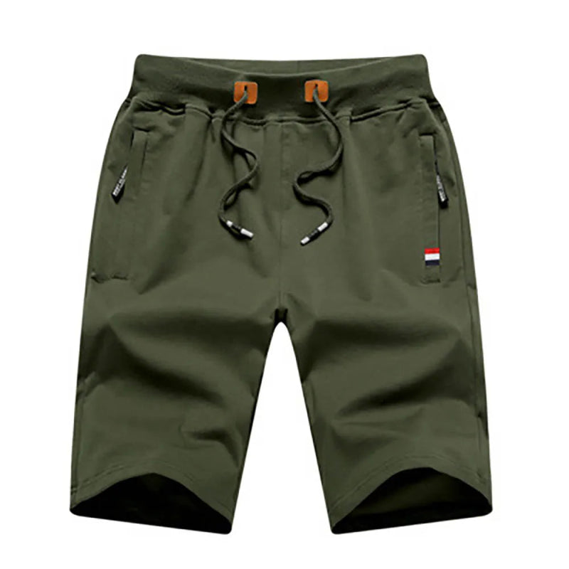 Green shorts with drawstring on a white background