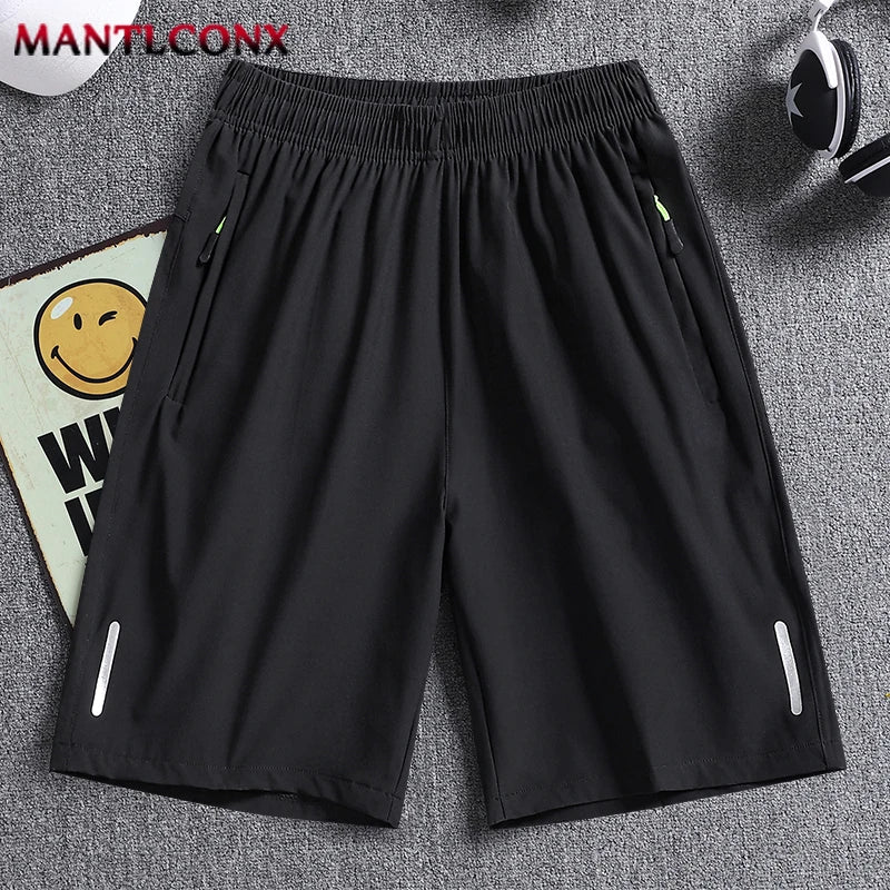 Black shorts on a gray background with 'MANTLCONX' branding.