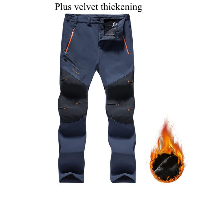 Blue pants with orange zippers and a flame graphic on a white background