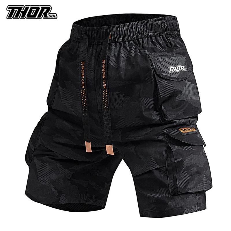 Black camouflage cargo shorts with 'Thor' branding on a white background