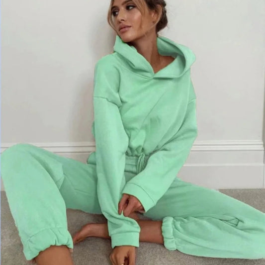 Women’s fashion two-piece sportswear set with long sleeves and high-waist casual pants in neutral tones