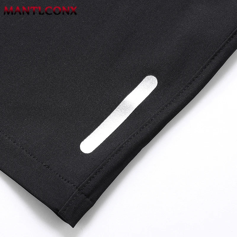 Black fabric with a reflective strip on a white background, featuring the brand 'MANTLCONX'.