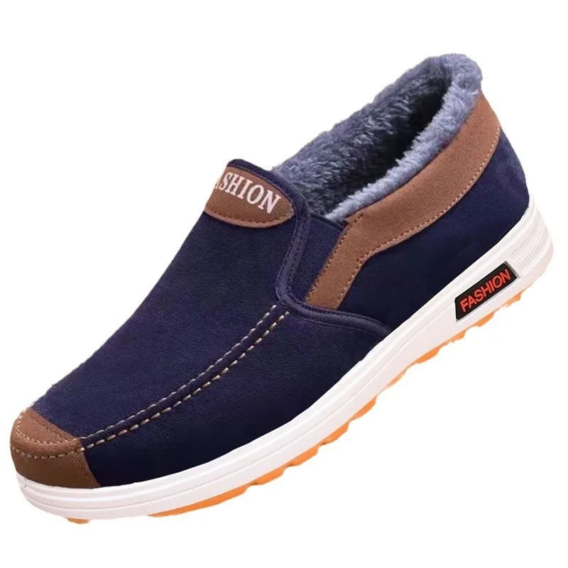 Navy slip-on shoe with brown accents on a white background