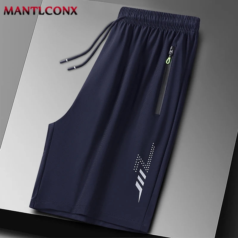 Navy blue shorts with a logo on a gray background, branded 'MANTLCONX'.