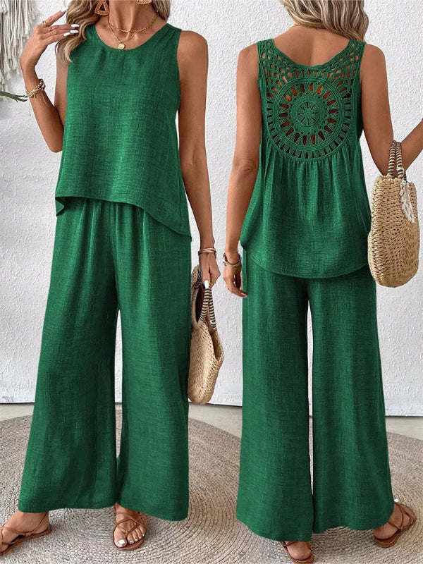 Green sleeveless top and wide-leg pants set with a textured surface, worn by a person.