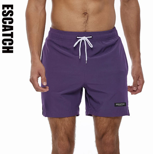 Purple swim shorts with a white drawstring on a white background, featuring the brand 'ESCACTH'.