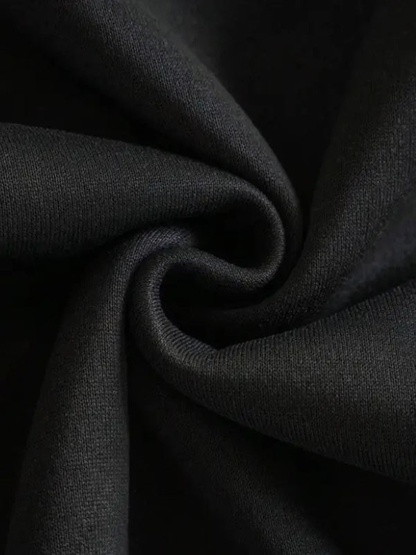 Close-up of dark gray fabric with folds