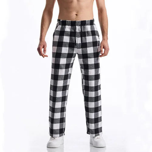 Black and white checkered pants worn by a person on a white background