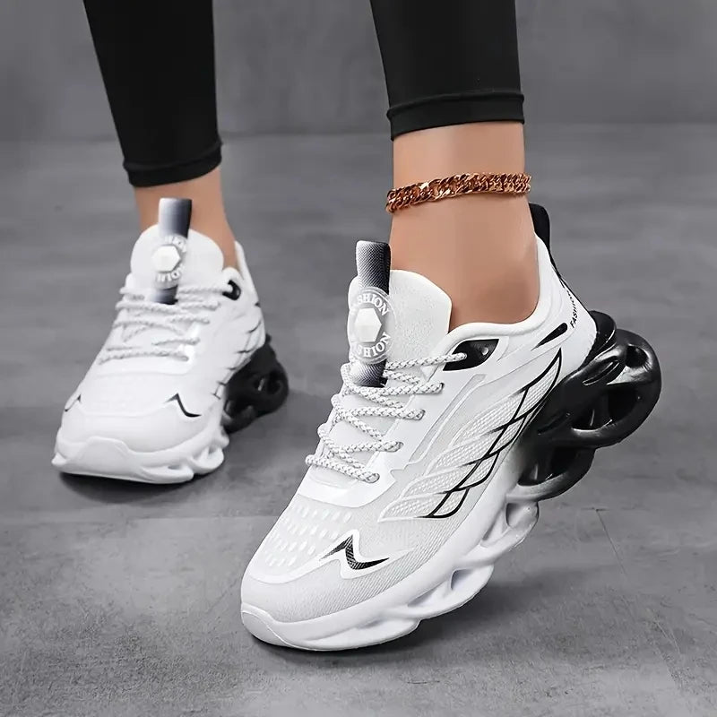 White sneakers with black soles on a gray background