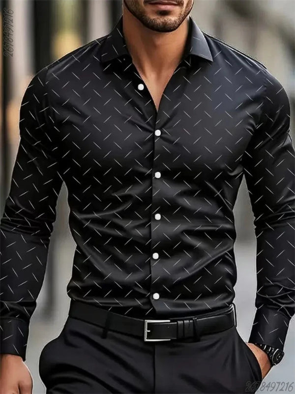 Man wearing a black patterned shirt with a blurred background