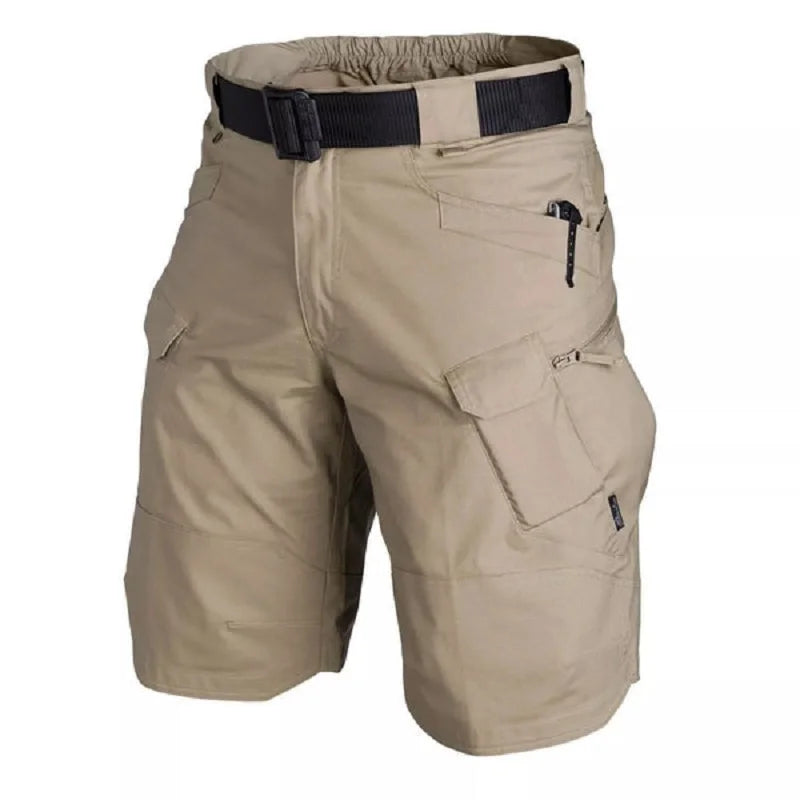 Beige tactical shorts with multiple pockets and a belt on a white background
