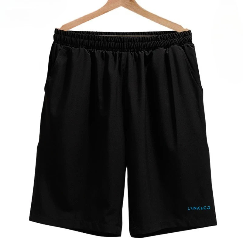 Black shorts on a hanger with a visible brand logo against a white background