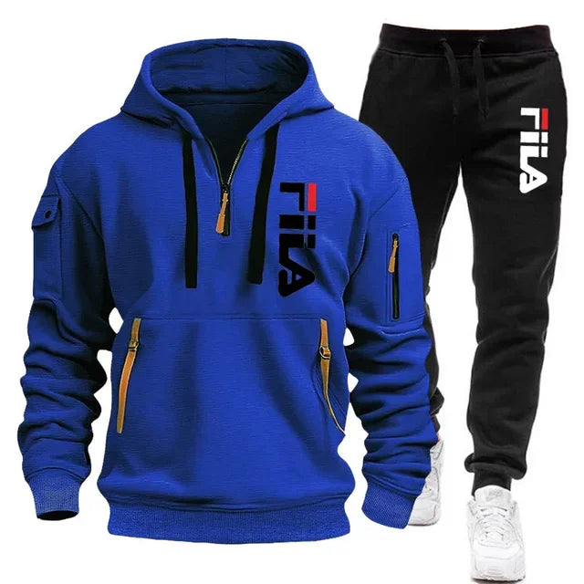 Blue hoodie and black pants with Fila logo on a white background