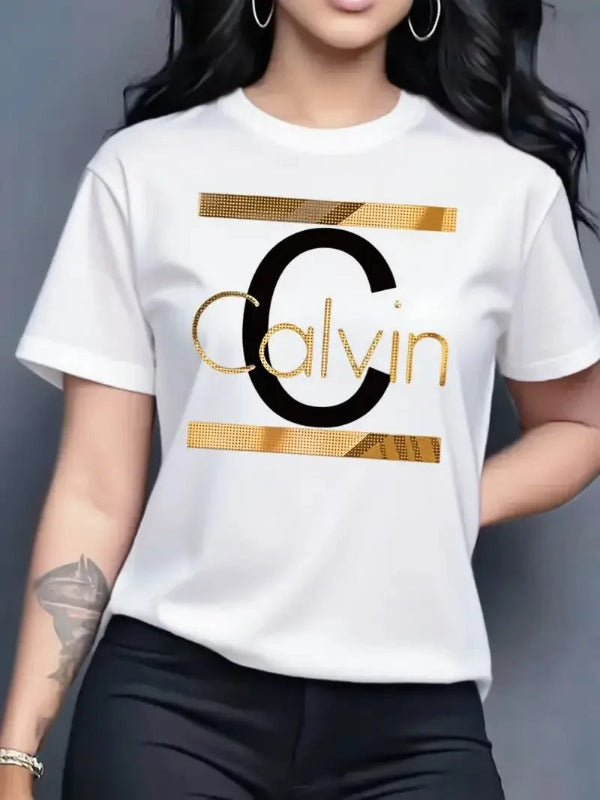 Person wearing a white t-shirt with a gold and black 'Calvin' logo on a dark background