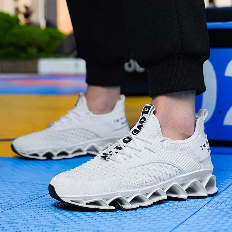 White athletic shoes with unique sole design on a blue floor.