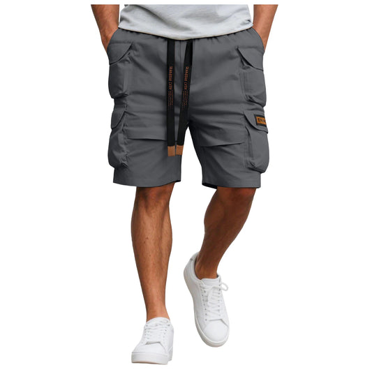 Person wearing gray cargo shorts on a white background