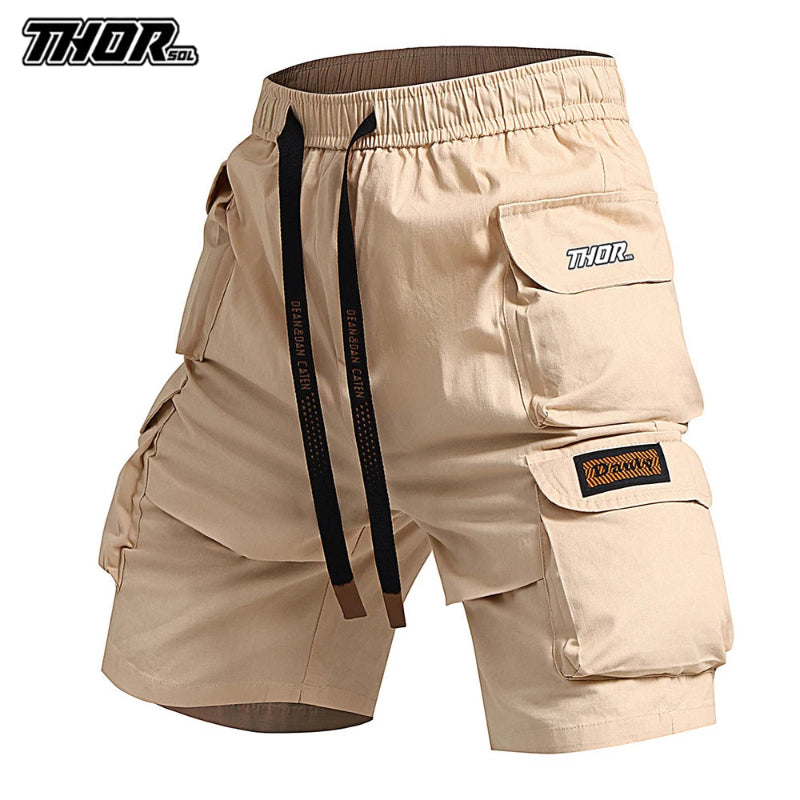Beige cargo shorts with multiple pockets and a visible brand logo on a white background