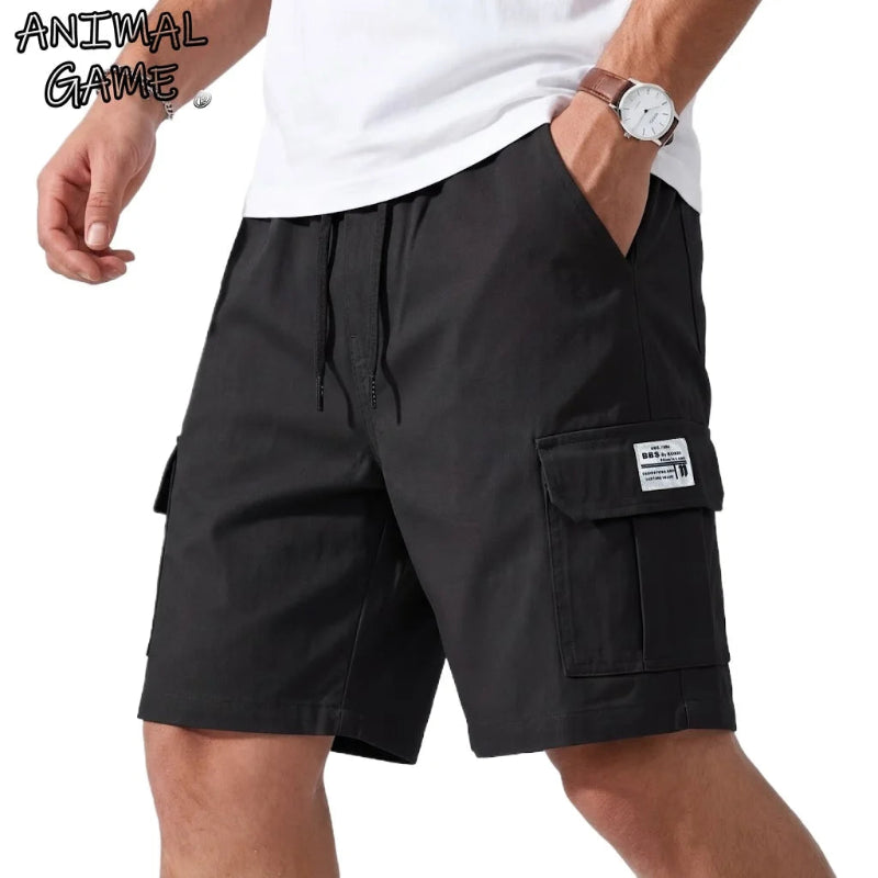 Black cargo shorts worn by a person on a white background with 'ANIMAL GAME' branding.