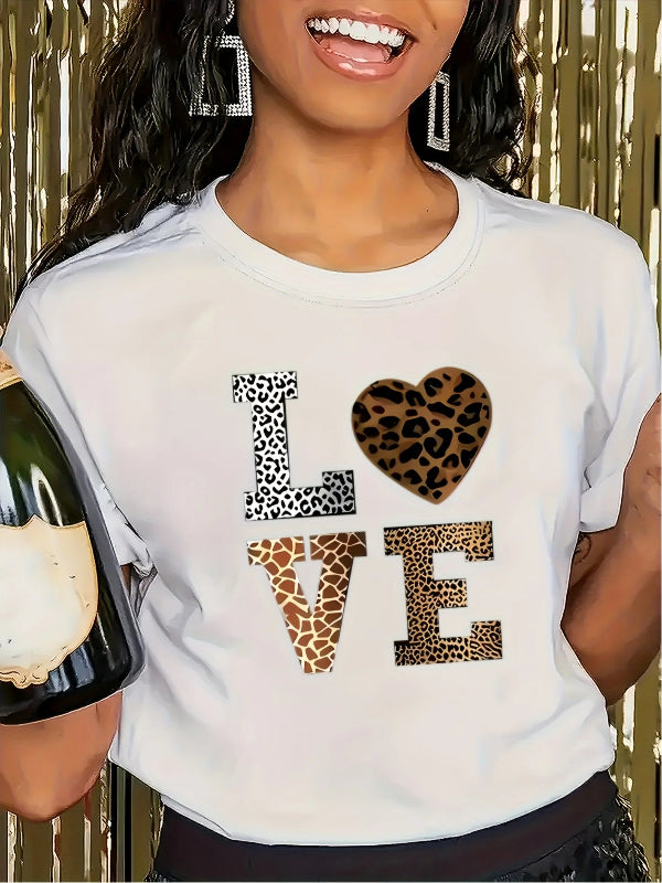Person wearing a white t-shirt with 'LOVE' in leopard print, holding a bottle of champagne.
