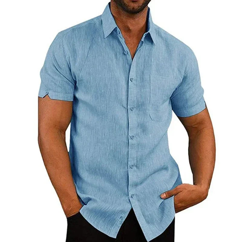 Man wearing a light blue short-sleeve shirt on a white background
