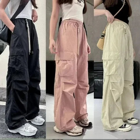 Three different styles of wide-leg pants worn by models in various colors.
