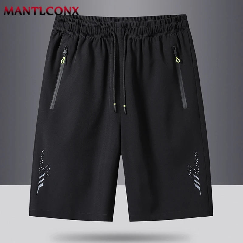 Black shorts with zippers on a gray background, featuring the brand 'MANTLCONX'.