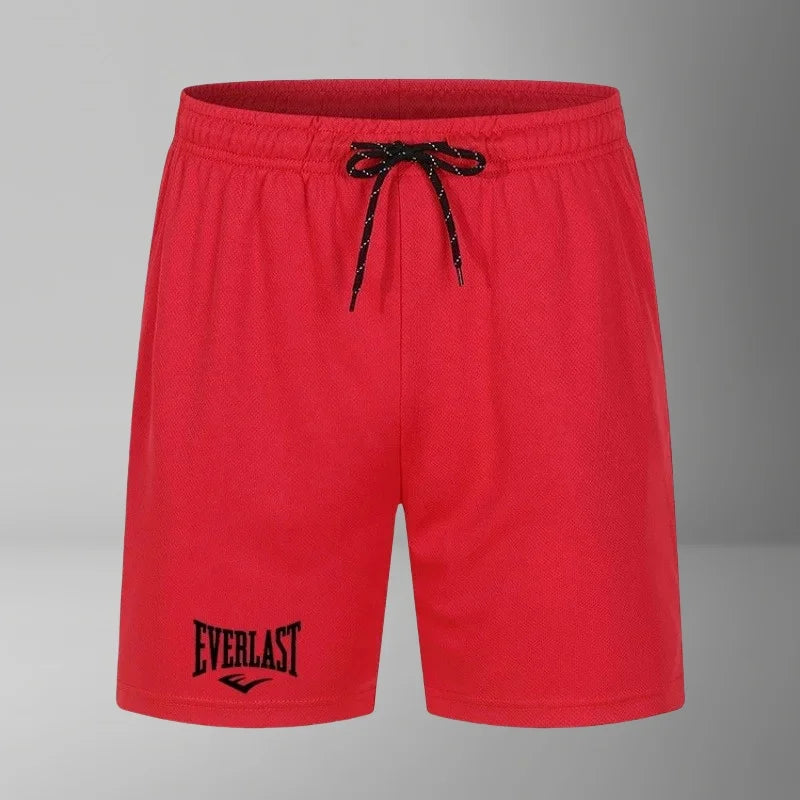 Red shorts with a black drawstring and 'Everlast' logo on a gray background