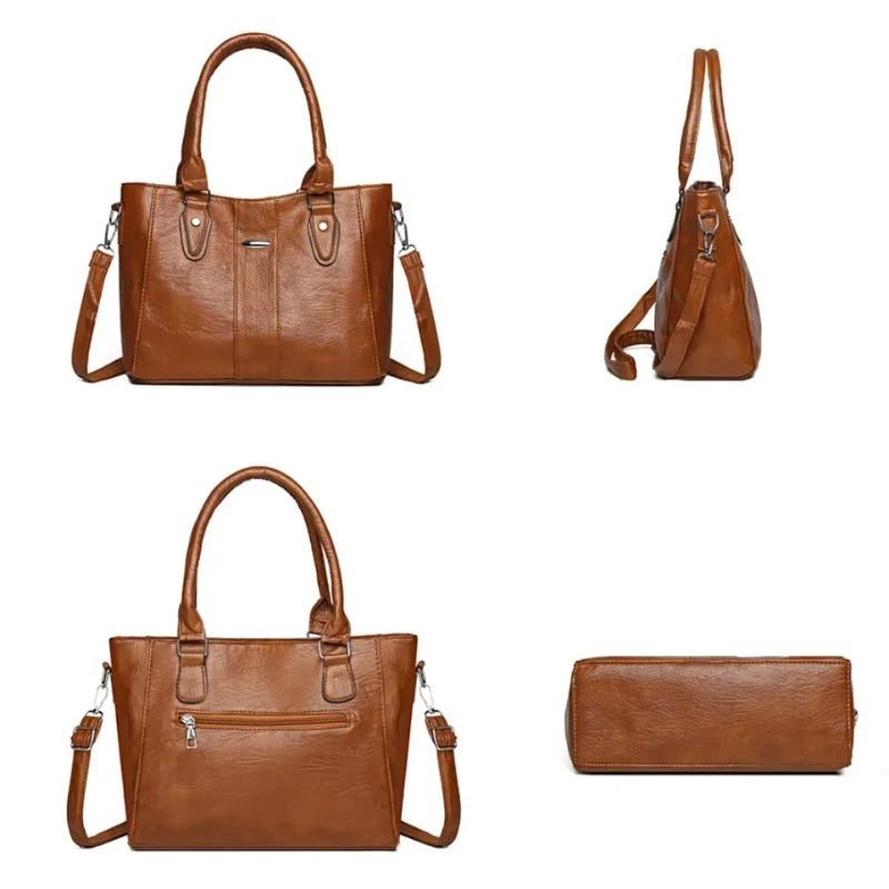 Brown leather handbag with shoulder strap and matching wallet on a white background