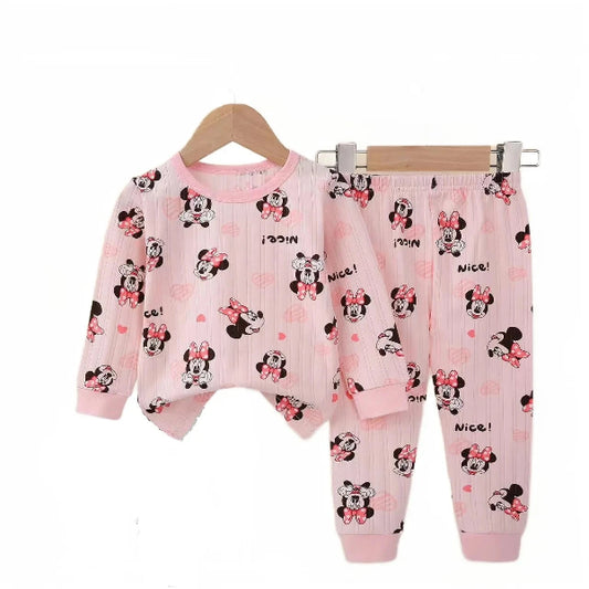 A baby girl's outfit set with long sleeves, featuring Minnie Mouse character designs, hanging on a wooden hanger.