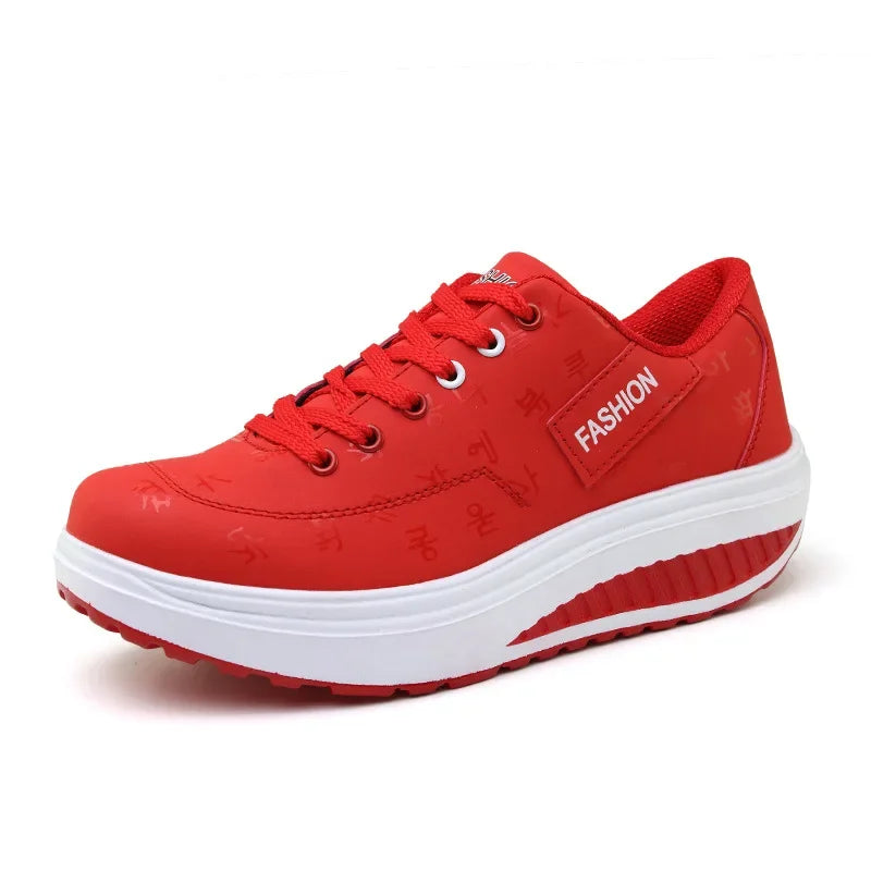 Red sneaker with a white sole on a white background