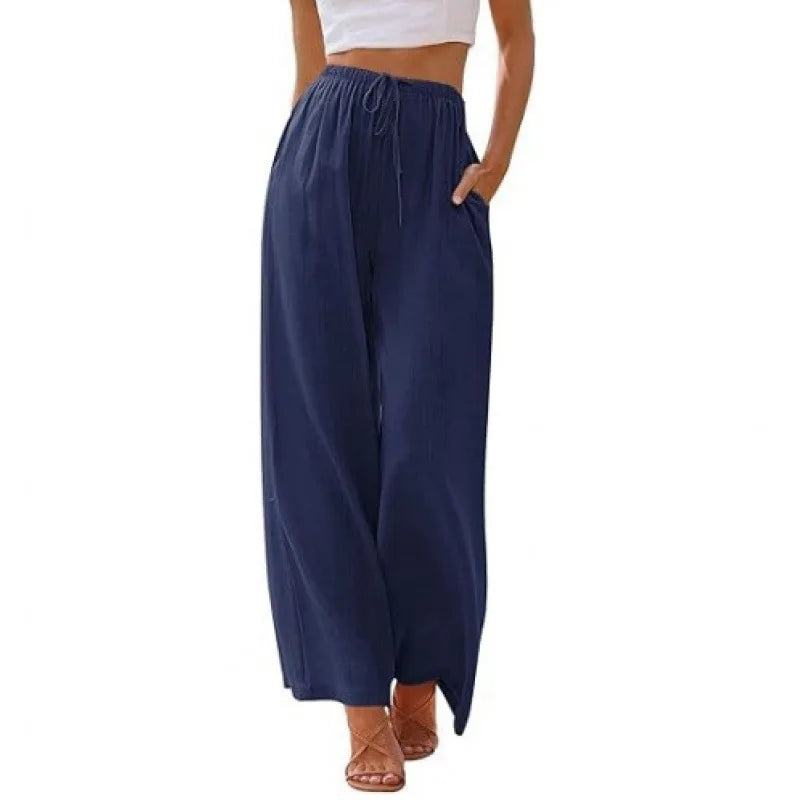 Navy blue wide-leg pants worn by a person on a white background