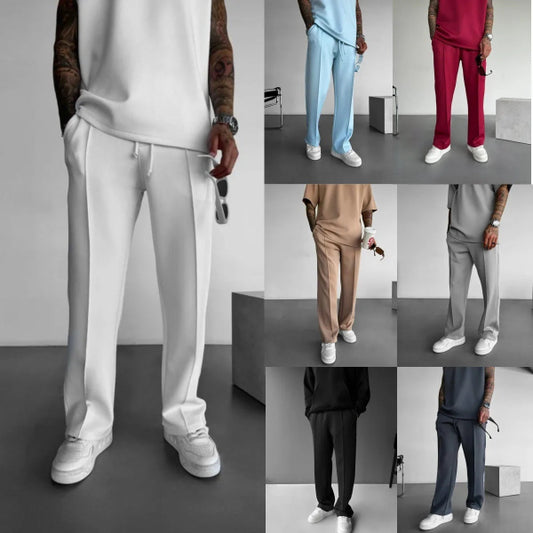 Men’s casual solid-color pants with elastic waist, drawstring closure, single-line pleats, and side pockets