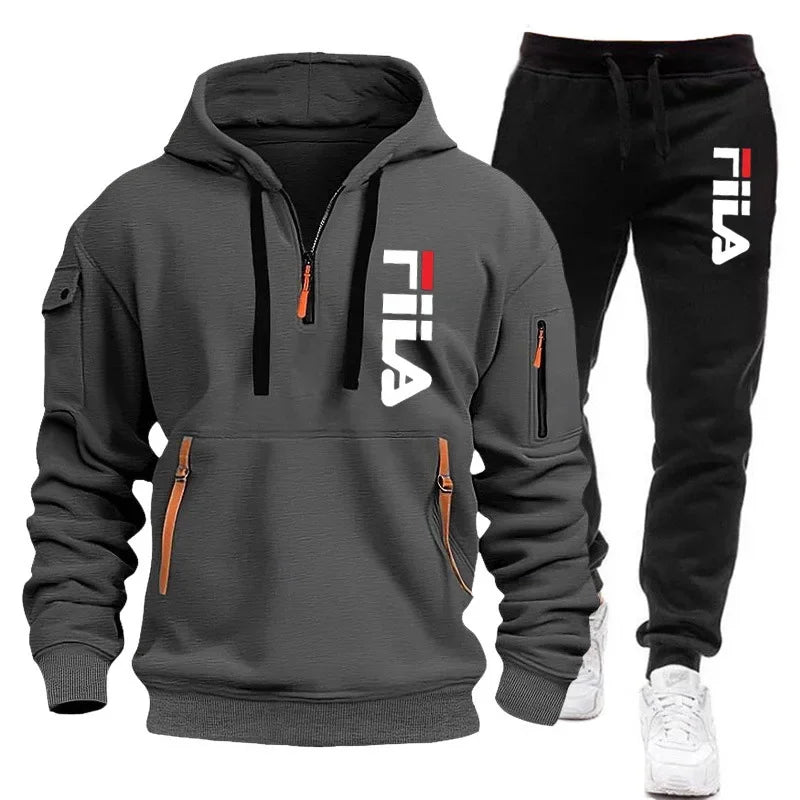 Gray hoodie and black pants with Fila logo on a white background