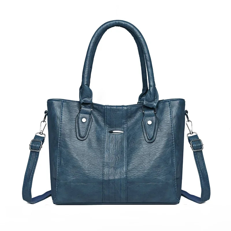 Blue handbag with a strap on a white background