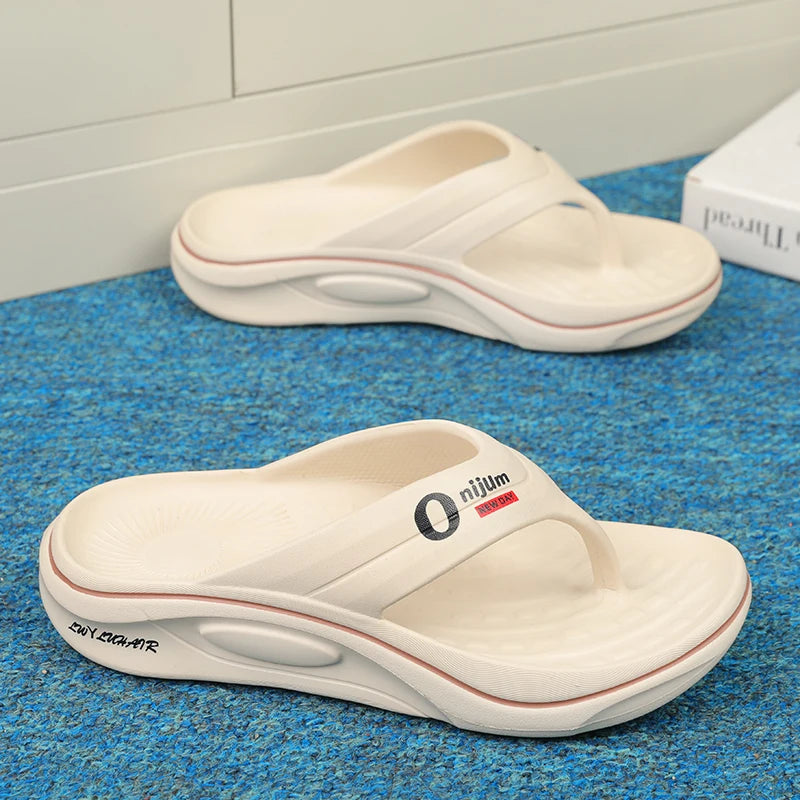 White sandals with a brand logo on a blue textured surface
