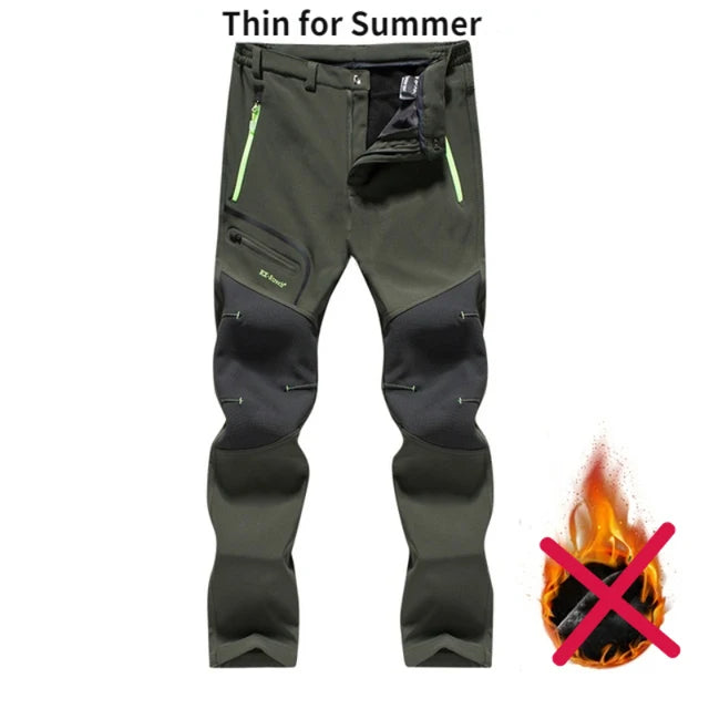 Dark green and black pants with flame and cross symbol on a white background