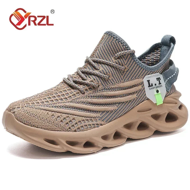 A pair of YRZL branded black sports running shoes with mesh upper material and a rubber outsole, displayed against a cardboard background.