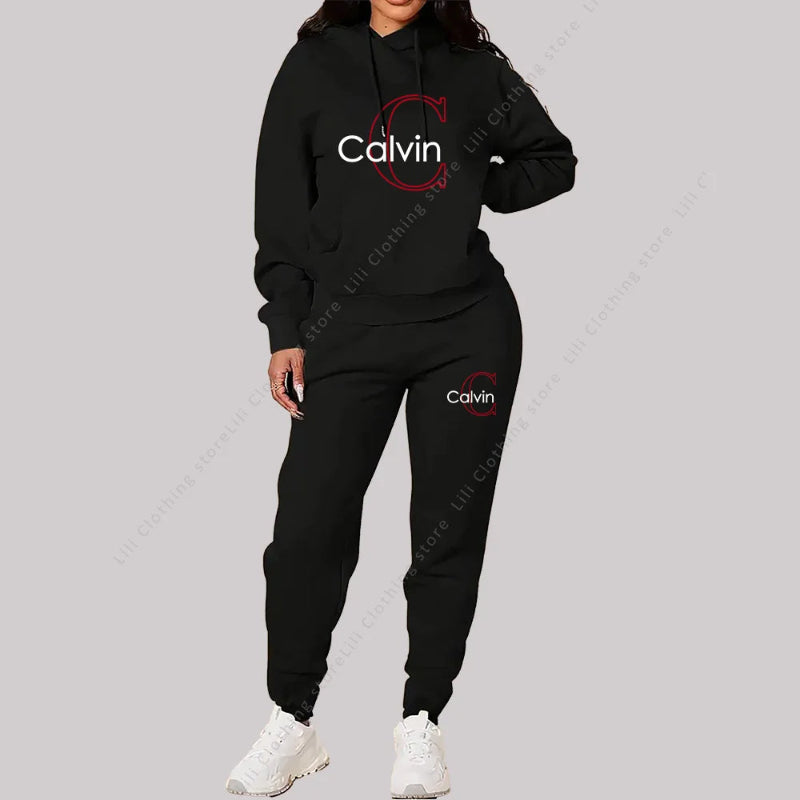 Black Calvin tracksuit worn by a person on a gray background