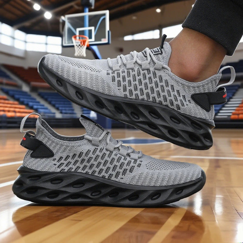 Gray and black athletic shoes on a basketball court