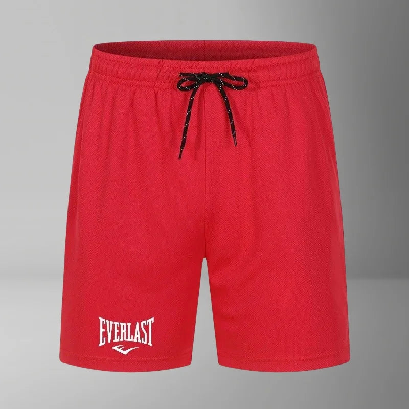 Red shorts with a black drawstring on a gray background