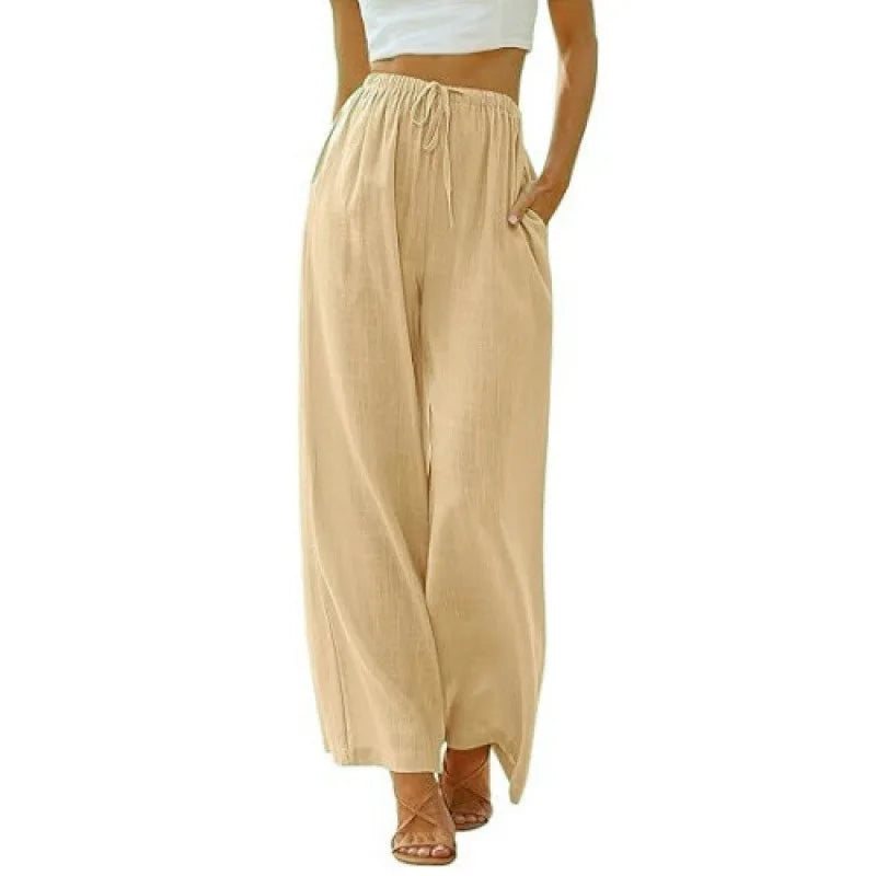 Beige wide-leg pants worn by a person on a white background