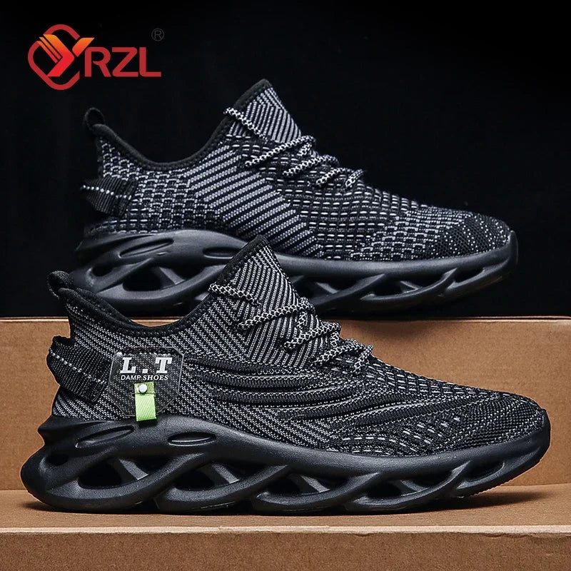 A pair of YRZL branded black sports running shoes with mesh upper material and a rubber outsole, displayed against a cardboard background.